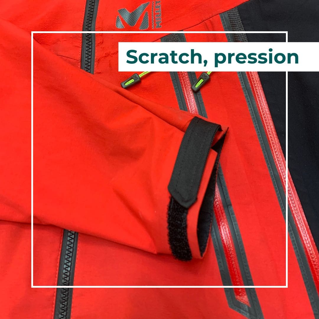 scratch velcro bouton pression patte de serrage sur une veste
