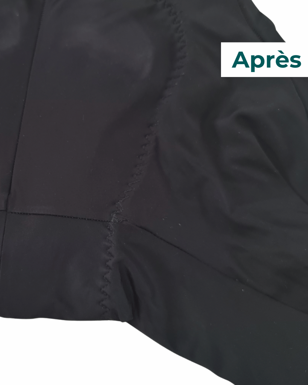 Short de cycliste noir réparé à la surjeteuse, coutures renforcées et propres.